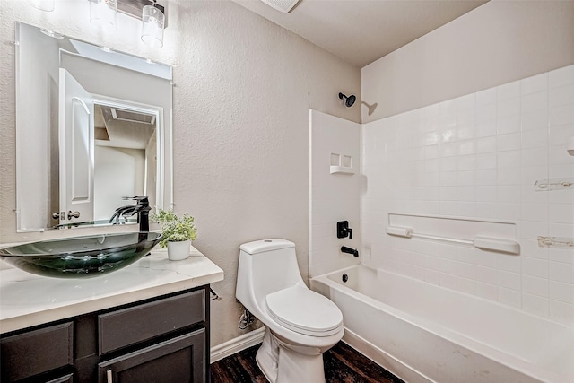 full bath featuring a textured wall, toilet, shower / tub combination, wood finished floors, and vanity