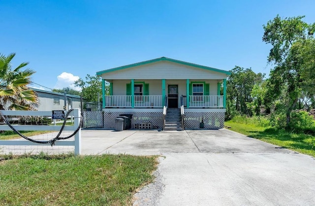 view of front of house with a front lawn and a porch