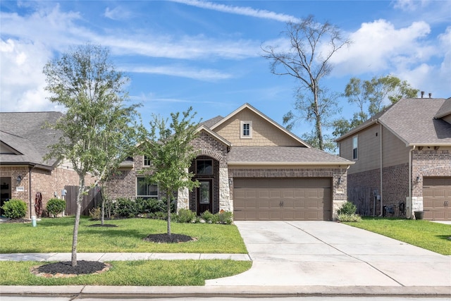 view of front of house featuring a garage and a front yard