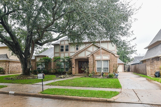 view of front of property with a garage and a front yard