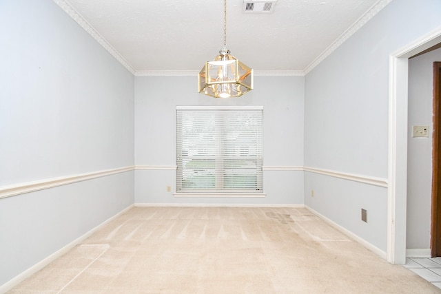 carpeted spare room featuring ornamental molding and an inviting chandelier