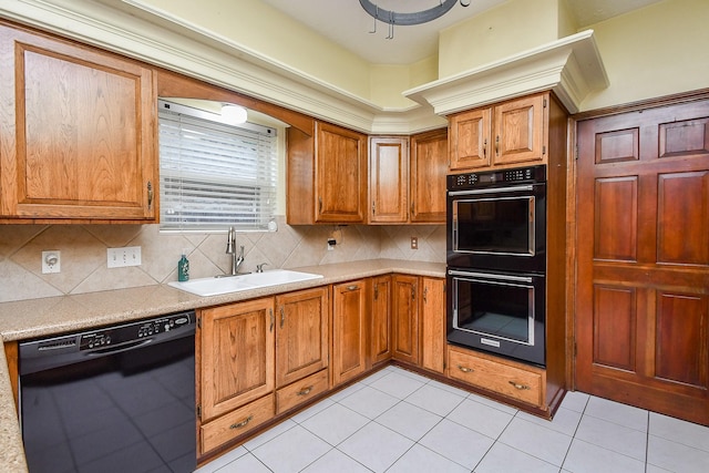 kitchen featuring sink, backsplash, black appliances, and light tile patterned flooring