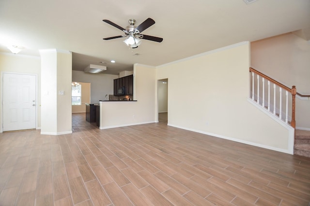 unfurnished living room with ceiling fan, ornamental molding, and light hardwood / wood-style floors