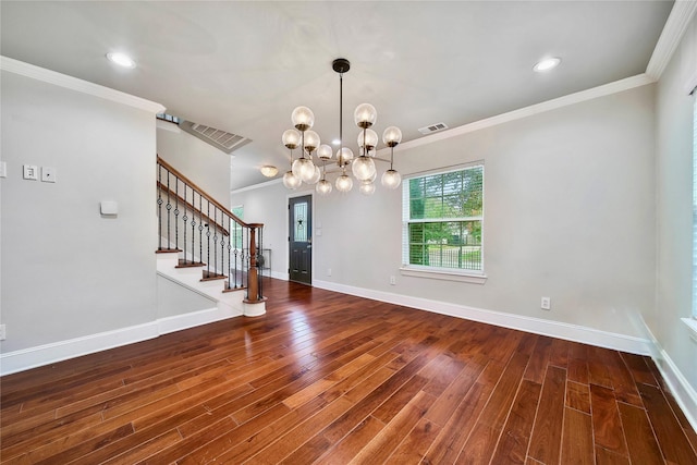 interior space featuring ornamental molding, hardwood / wood-style floors, and an inviting chandelier