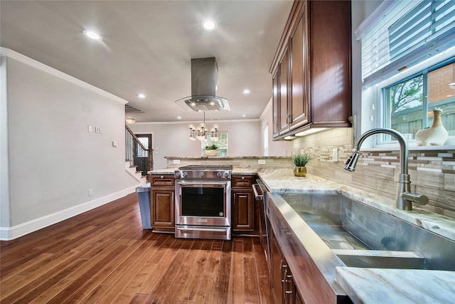 kitchen with crown molding, sink, island range hood, and stainless steel range with gas stovetop