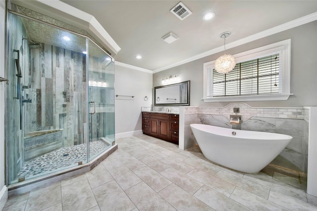 bathroom with shower with separate bathtub, tile walls, tile patterned flooring, vanity, and crown molding