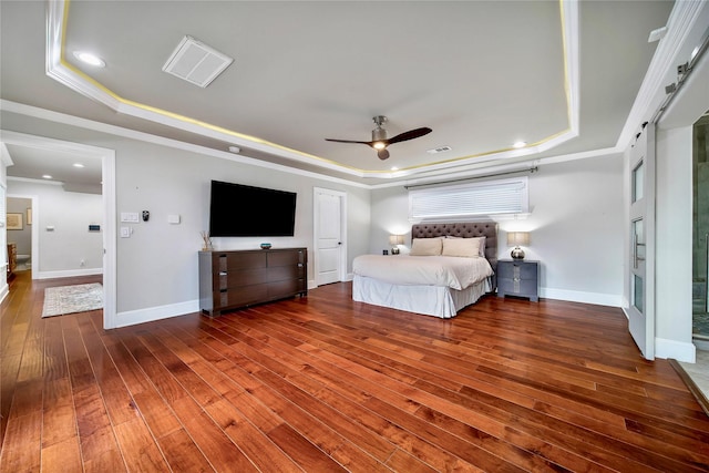 unfurnished bedroom with dark hardwood / wood-style flooring, ornamental molding, a raised ceiling, and ceiling fan