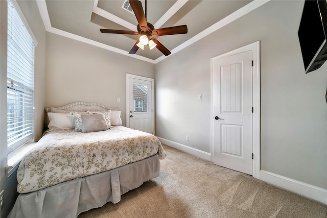 bedroom featuring ornamental molding, light carpet, and ceiling fan