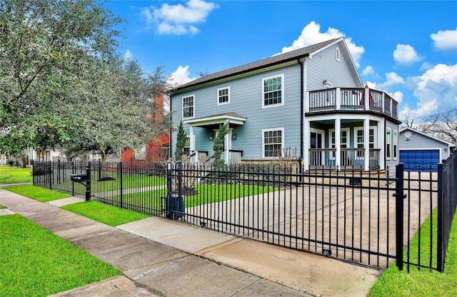 view of front of home featuring a garage, a balcony, an outbuilding, a front yard, and covered porch