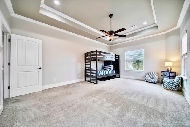 unfurnished bedroom featuring crown molding, ceiling fan, carpet flooring, and a raised ceiling