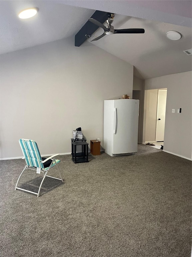 unfurnished room featuring vaulted ceiling with beams, ceiling fan, and carpet