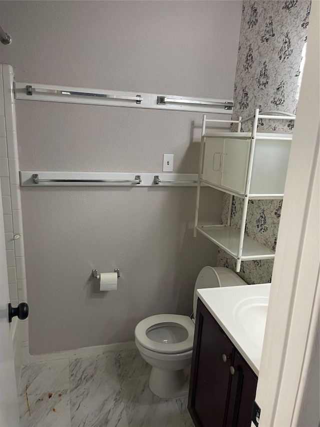 bathroom featuring vanity and toilet