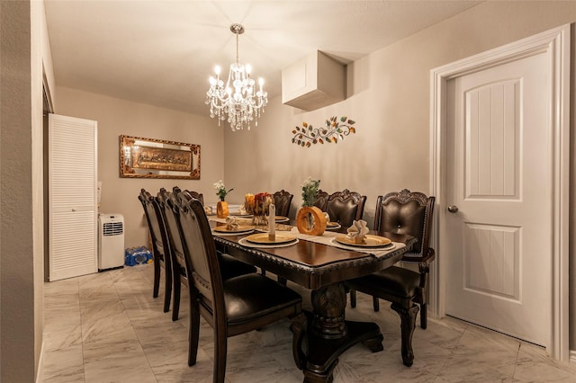 dining area featuring an inviting chandelier