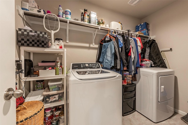 washroom with washer and dryer