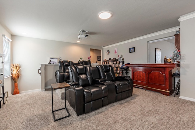 cinema room featuring light carpet and ornamental molding