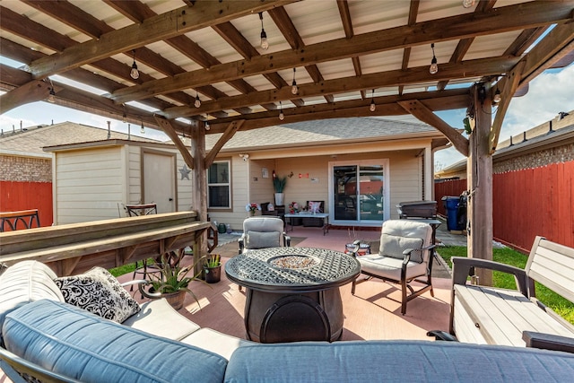 view of patio / terrace with an outdoor living space with a fire pit