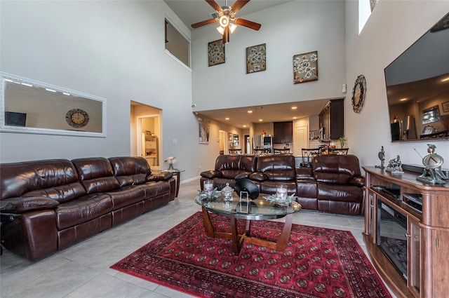 tiled living room featuring ceiling fan