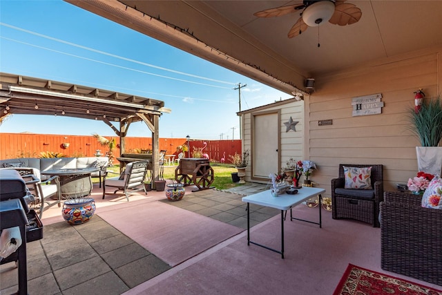 view of patio featuring a pergola, outdoor lounge area, and ceiling fan