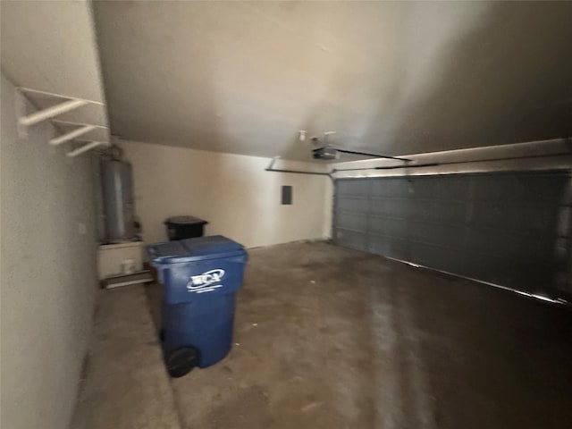 garage with a garage door opener and gas water heater