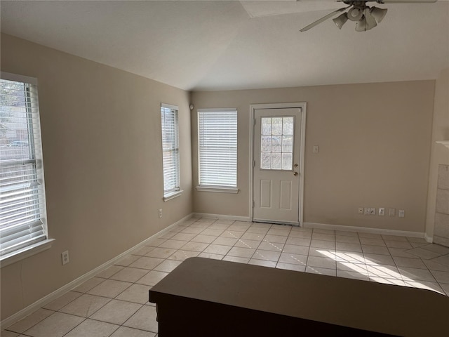 tiled entryway with ceiling fan and vaulted ceiling