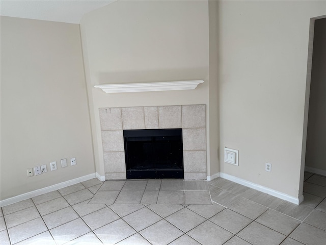 interior details with a tile fireplace