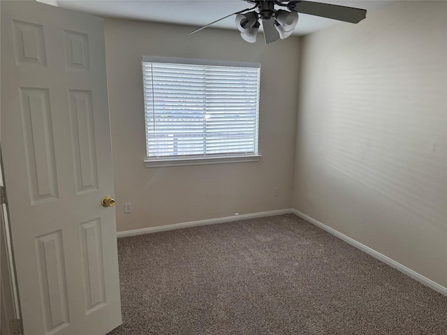 carpeted empty room featuring ceiling fan