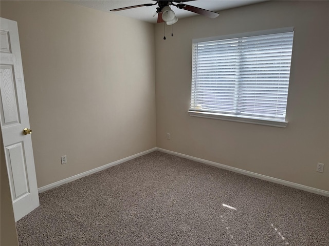 unfurnished room with carpet flooring and ceiling fan