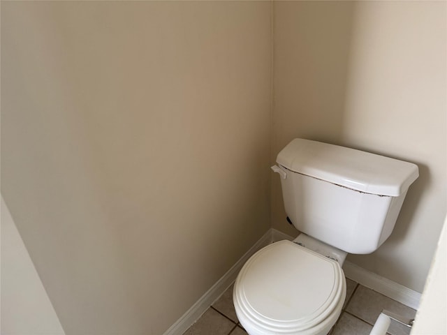 bathroom featuring tile patterned floors and toilet