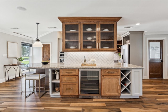 bar featuring crown molding, light stone counters, hanging light fixtures, high quality fridge, and beverage cooler