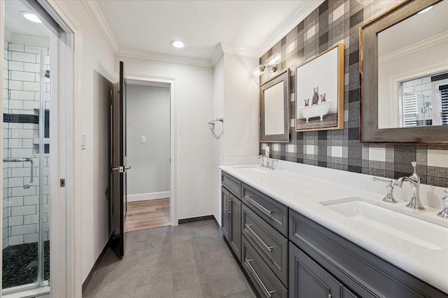 bathroom with tile patterned floors, ornamental molding, an enclosed shower, and vanity