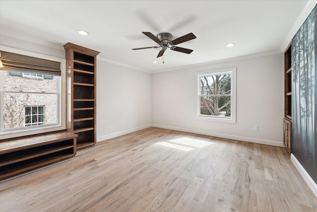 unfurnished living room featuring ceiling fan, ornamental molding, and light wood-type flooring