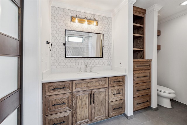 bathroom with vanity, crown molding, tile patterned floors, and toilet