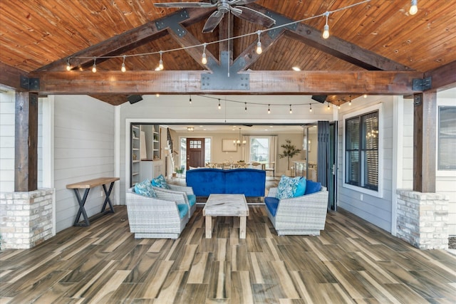 wooden terrace with ceiling fan and an outdoor hangout area