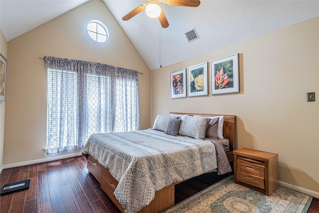 bedroom featuring vaulted ceiling, dark hardwood / wood-style floors, and ceiling fan