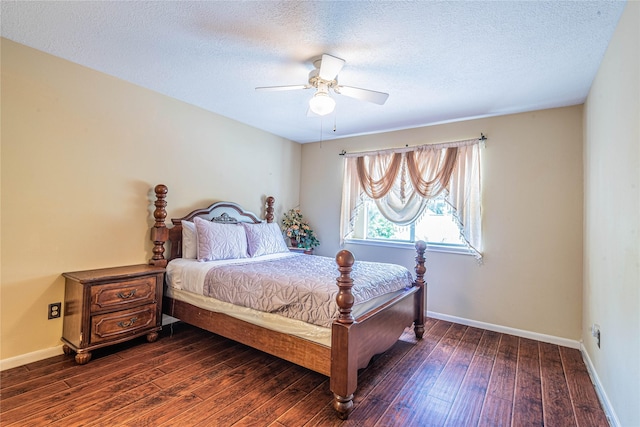 bedroom featuring ceiling fan, dark hardwood / wood-style floors, and a textured ceiling