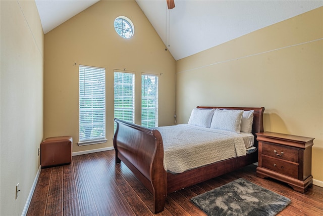 bedroom with ceiling fan, high vaulted ceiling, and dark hardwood / wood-style flooring