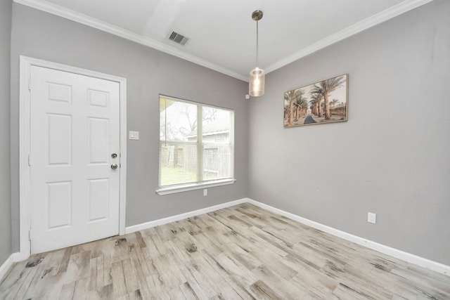 interior space with crown molding and light wood-type flooring