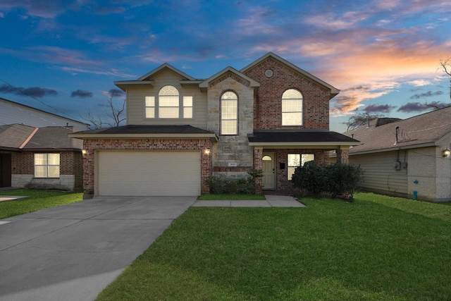 view of front of house with a garage and a lawn