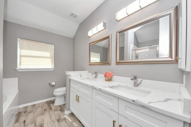 full bathroom with lofted ceiling, toilet, shower with separate bathtub, vanity, and hardwood / wood-style floors