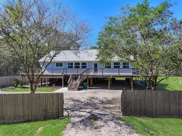 view of front of home featuring a carport and a deck