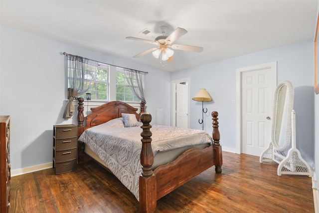 bedroom with dark wood-type flooring and ceiling fan