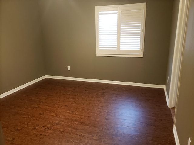 empty room featuring dark hardwood / wood-style flooring