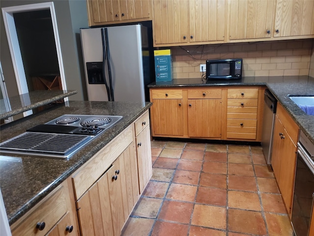 kitchen with tasteful backsplash and black appliances