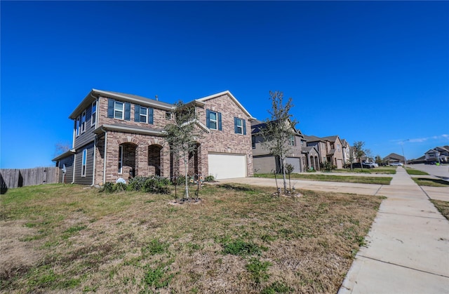 view of front facade featuring a garage and a front yard