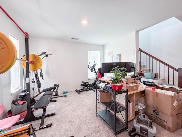 exercise room with carpet flooring