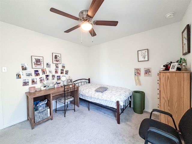 bedroom featuring ceiling fan and light colored carpet