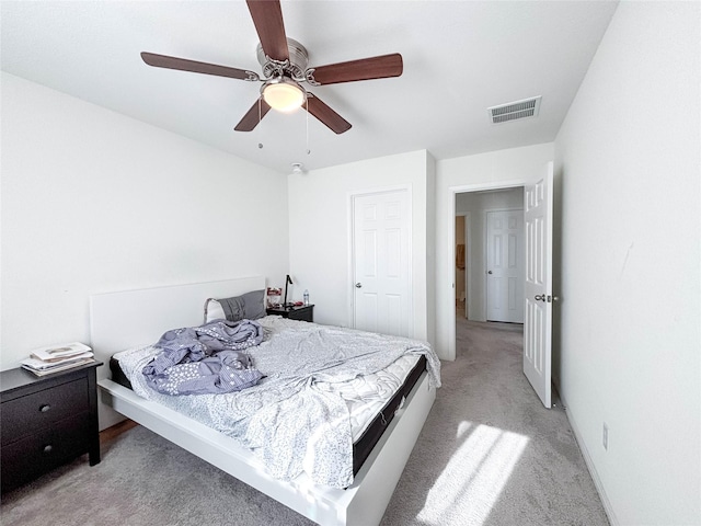 carpeted bedroom featuring ceiling fan