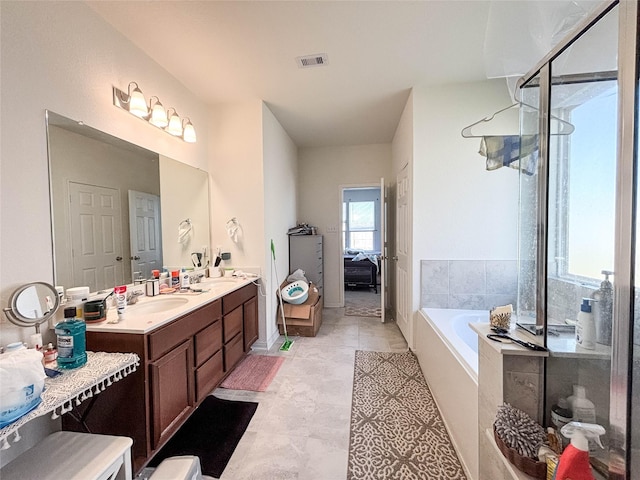 bathroom with vanity and a bathtub