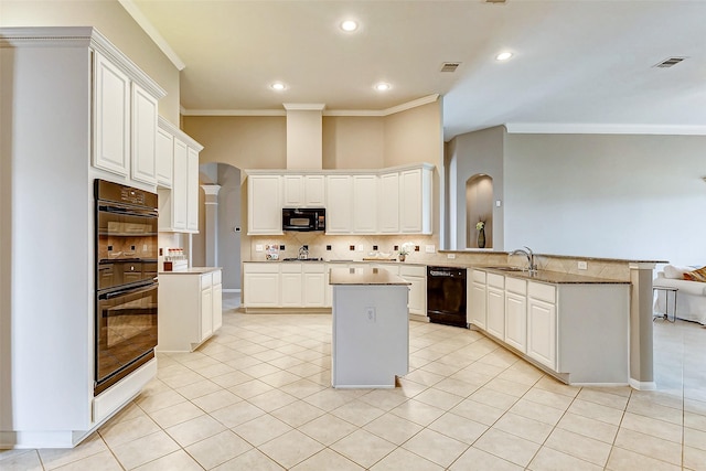 kitchen featuring white cabinetry, black appliances, and kitchen peninsula