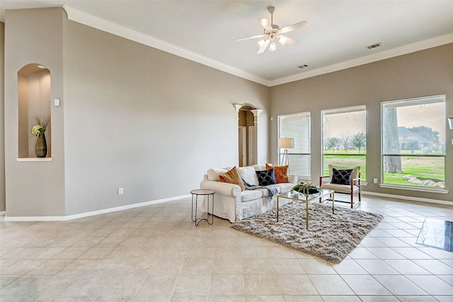 living room with crown molding, ceiling fan, and light tile patterned flooring